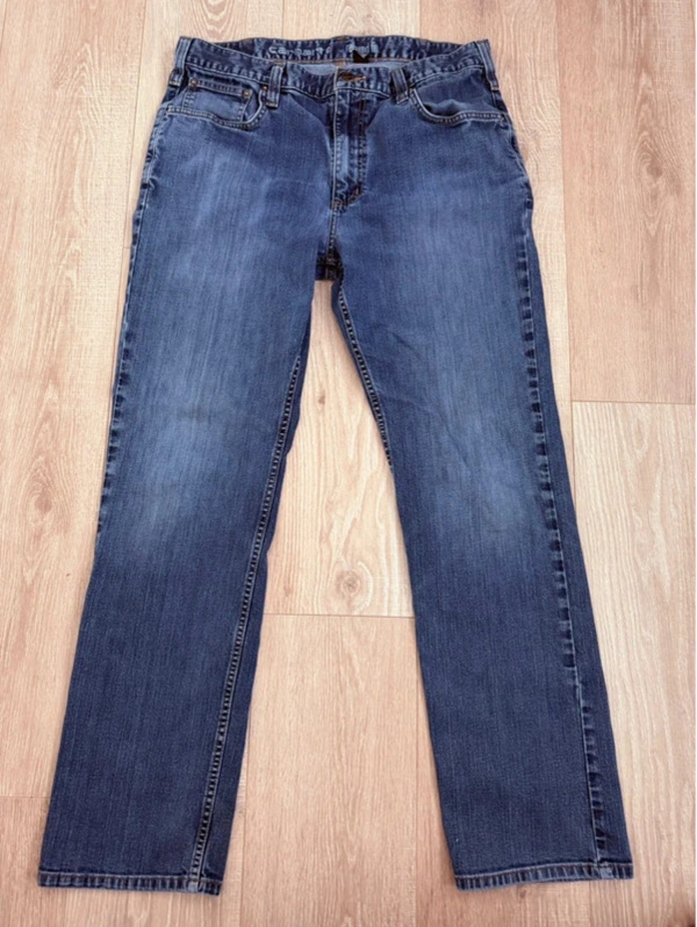 Carhartt relaxed-fit medium wash denim work jeans